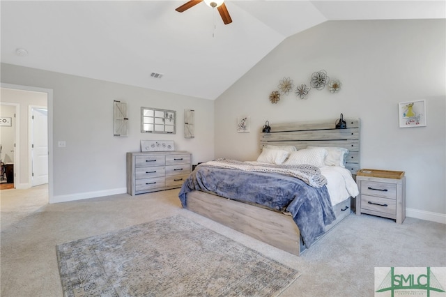 carpeted bedroom with ceiling fan and vaulted ceiling