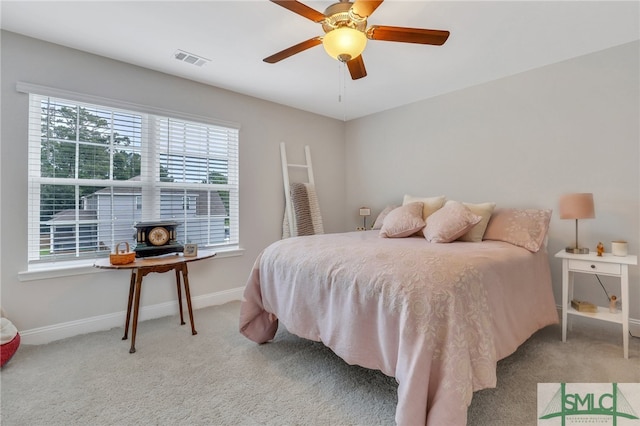 carpeted bedroom with ceiling fan