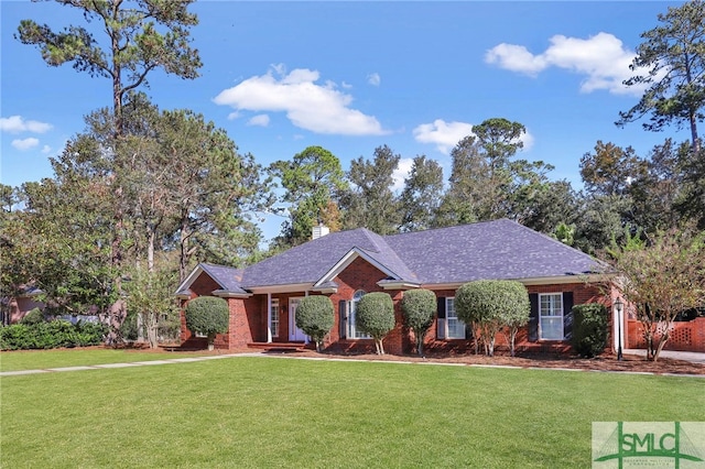 ranch-style house with a front lawn