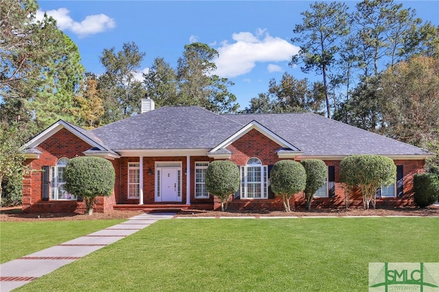 ranch-style house with a front lawn