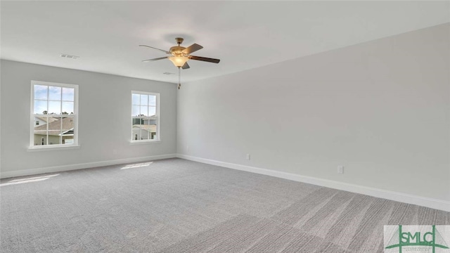 empty room with carpet and ceiling fan