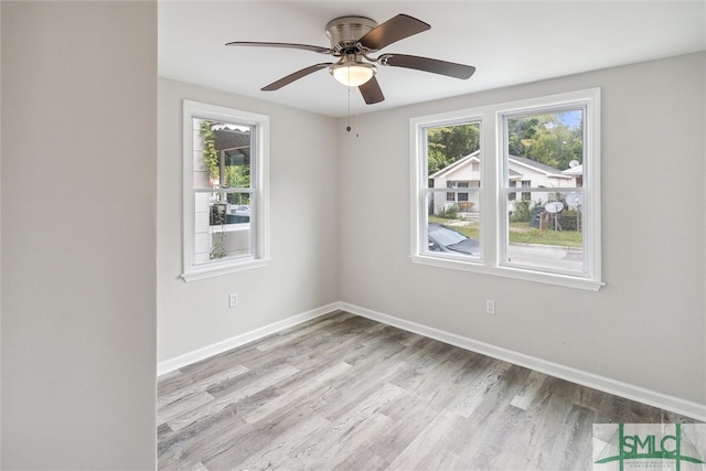 unfurnished room featuring ceiling fan and light hardwood / wood-style floors