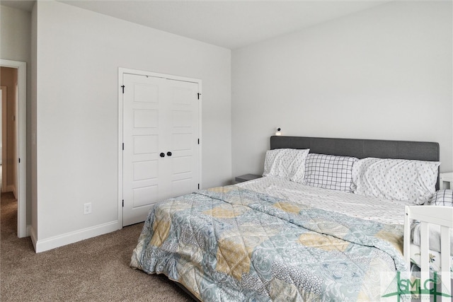 bedroom featuring carpet and a closet