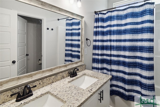 bathroom featuring vanity and shower / bath combo with shower curtain