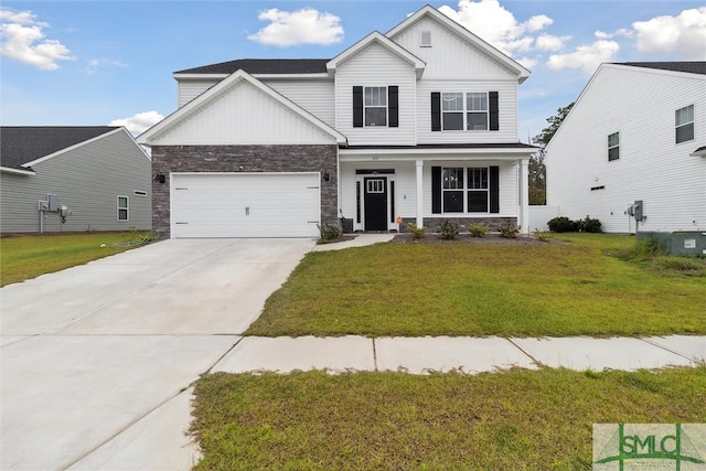 view of front of home with a garage, a front lawn, and central AC