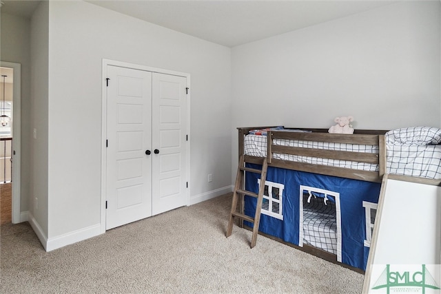 carpeted bedroom featuring a closet