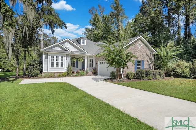 view of front of home with a front yard and a garage