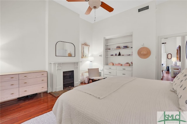 bedroom featuring ceiling fan and dark wood-type flooring