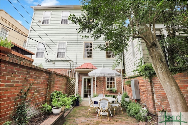 rear view of house featuring a patio