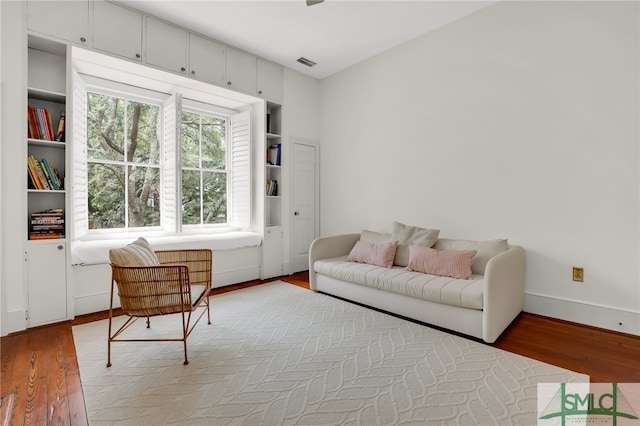 sitting room featuring hardwood / wood-style floors