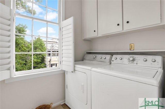 laundry area with cabinets and independent washer and dryer