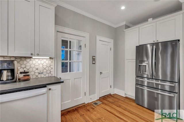 202 E 51st St, Savannah, GA 31405 - kitchen with stainless steel fridge with ice dispenser, white dishwasher, ornamental molding, backsplash, and light wood-style floors