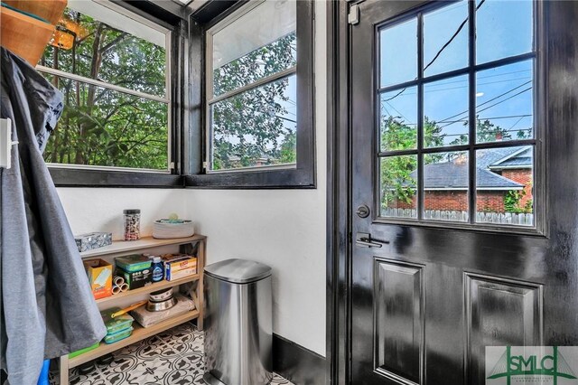 doorway to outside featuring plenty of natural light