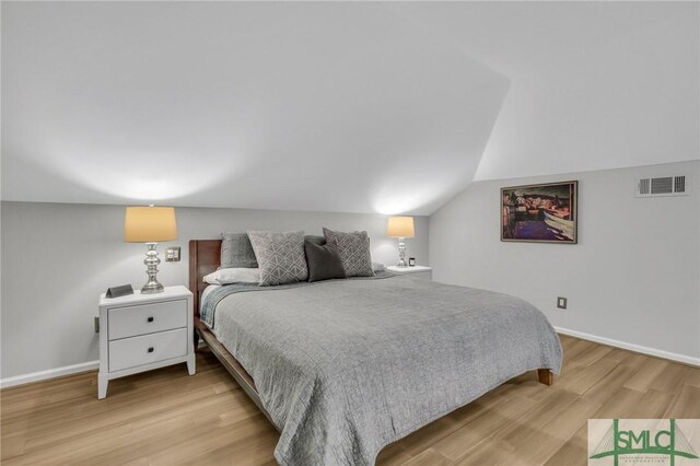 202 E 51st St, Savannah, GA 31405 - bedroom featuring wood finished floors, baseboards, and vaulted ceiling