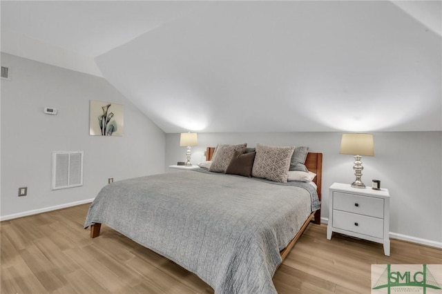 202 E 51st St, Savannah, GA 31405 - bedroom with wood finished floors, vaulted ceiling, and baseboards