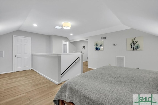 202 E 51st St, Savannah, GA 31405 - bedroom with light wood finished floors, vaulted ceiling, baseboards, and recessed lighting