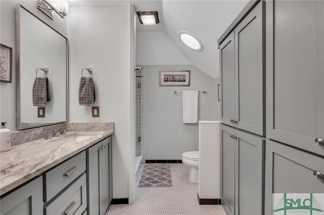 bathroom featuring toilet, walk in shower, tile patterned floors, vanity, and lofted ceiling