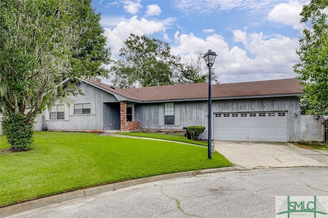 single story home featuring a garage and a front yard