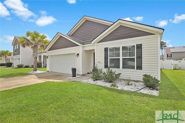 view of front of house featuring a front yard and a garage