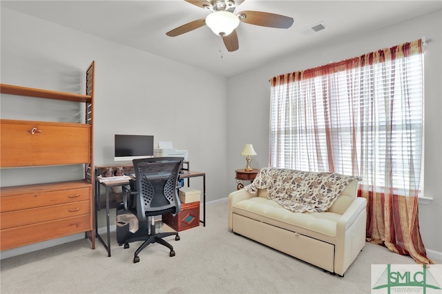 home office with light carpet and ceiling fan