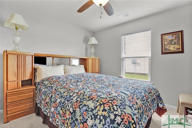 carpeted bedroom featuring ceiling fan