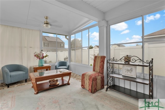 sunroom with ceiling fan