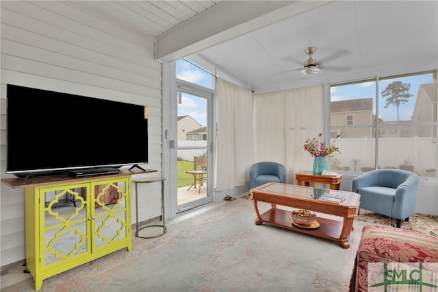 sunroom featuring ceiling fan