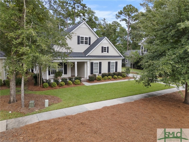 view of front of property with a front lawn and covered porch