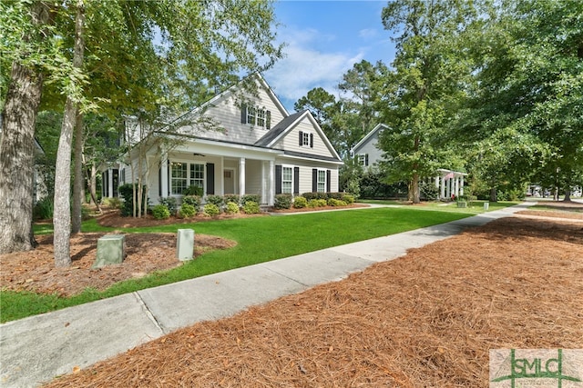 view of front of home featuring a front yard and covered porch