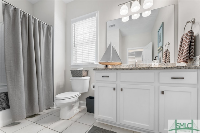 bathroom featuring vanity, toilet, and tile patterned floors