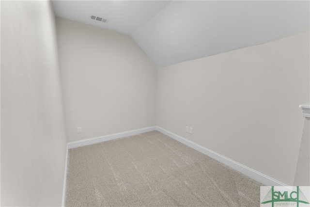 additional living space with light carpet and lofted ceiling