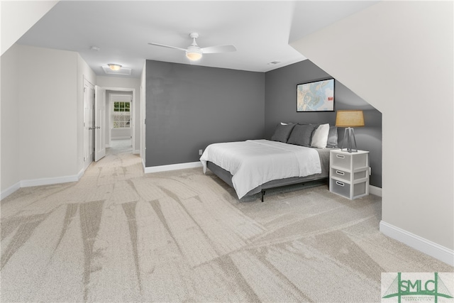 carpeted bedroom featuring ceiling fan