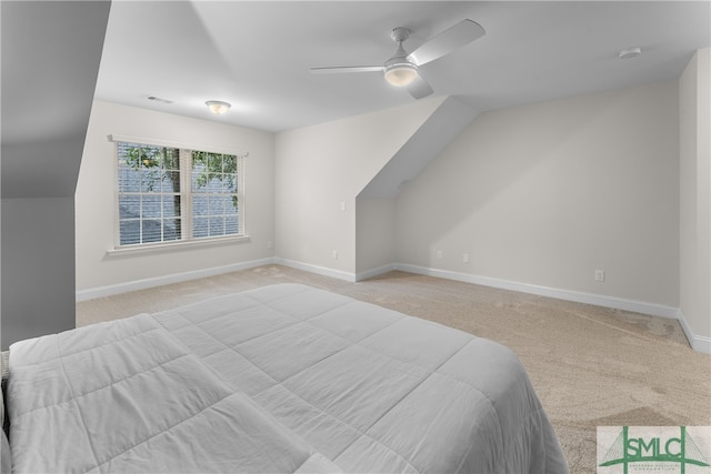 carpeted bedroom with lofted ceiling and ceiling fan