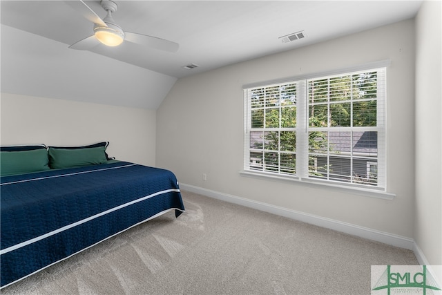 bedroom featuring lofted ceiling, carpet, and ceiling fan