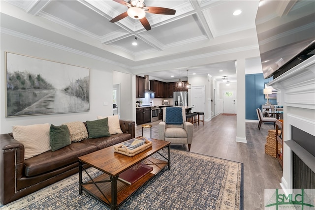 living room featuring coffered ceiling, crown molding, ceiling fan, dark hardwood / wood-style floors, and beam ceiling