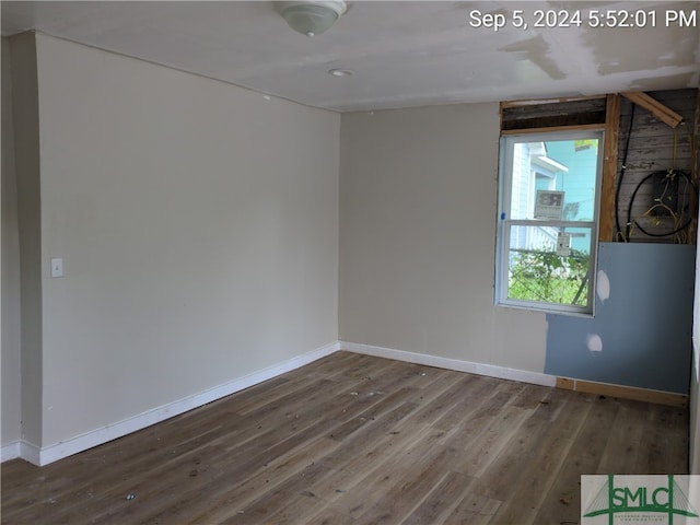 empty room featuring hardwood / wood-style flooring