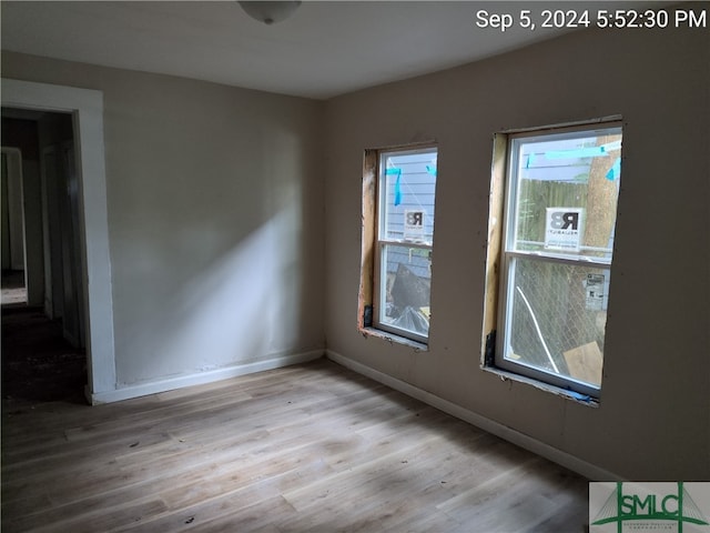 spare room with light hardwood / wood-style floors