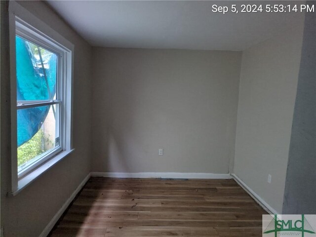 spare room featuring hardwood / wood-style flooring