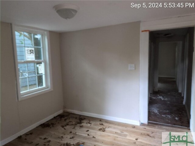 unfurnished room with light hardwood / wood-style floors