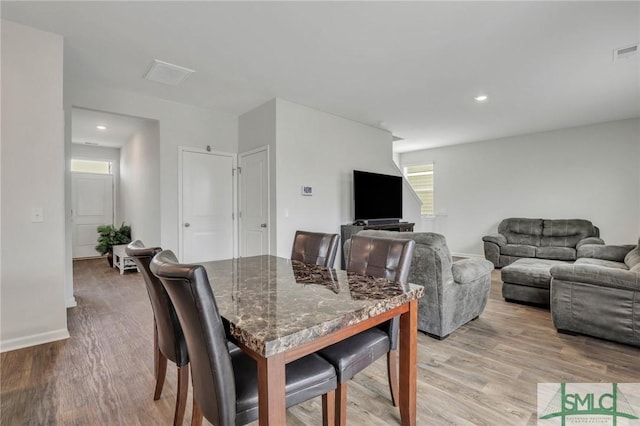 dining space with visible vents, recessed lighting, baseboards, and light wood-style floors