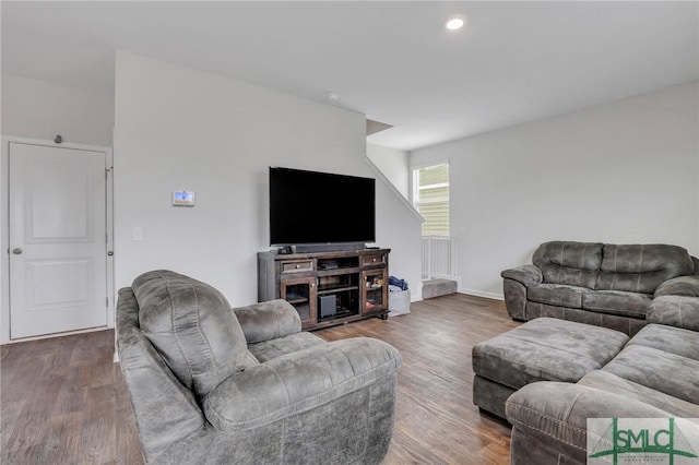 living area with recessed lighting, wood finished floors, and baseboards