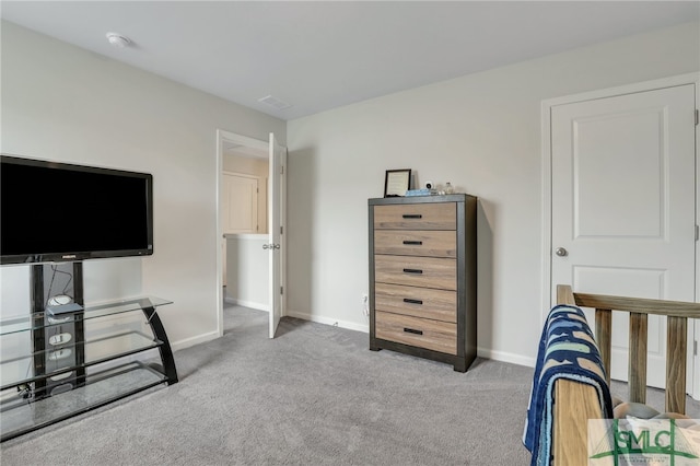 bedroom featuring baseboards and carpet