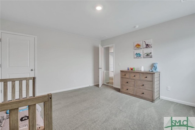 bedroom featuring carpet flooring and baseboards