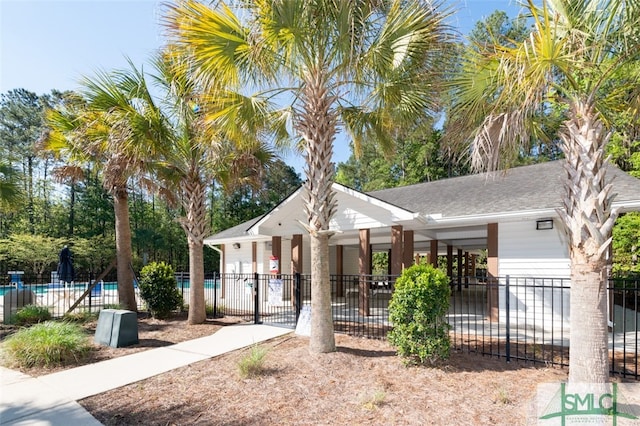 view of front of property with a community pool