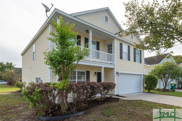 view of front of property featuring a balcony and a garage