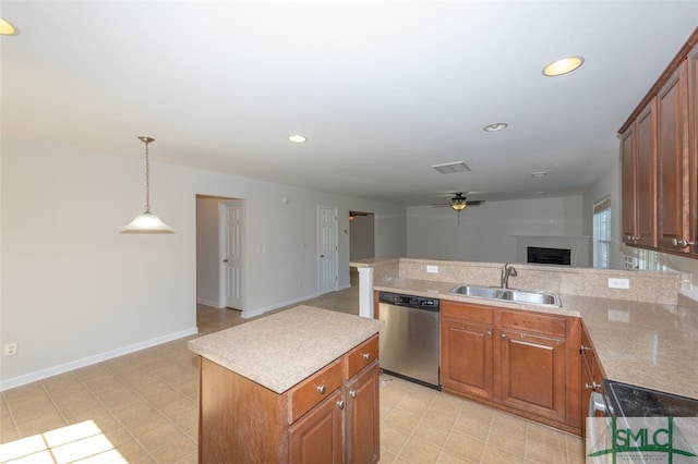 kitchen featuring sink, a center island, ceiling fan, pendant lighting, and stainless steel dishwasher