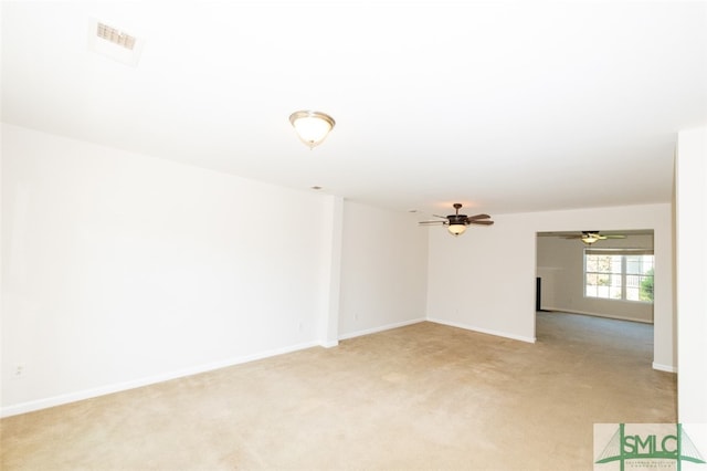 unfurnished room with light carpet and ceiling fan