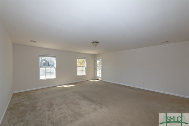 empty room featuring light carpet