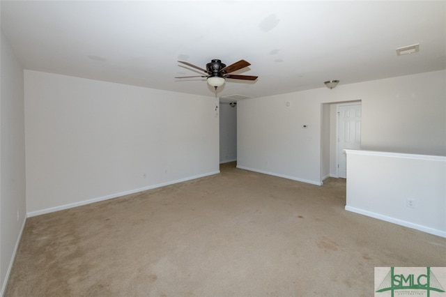 empty room with light carpet and ceiling fan