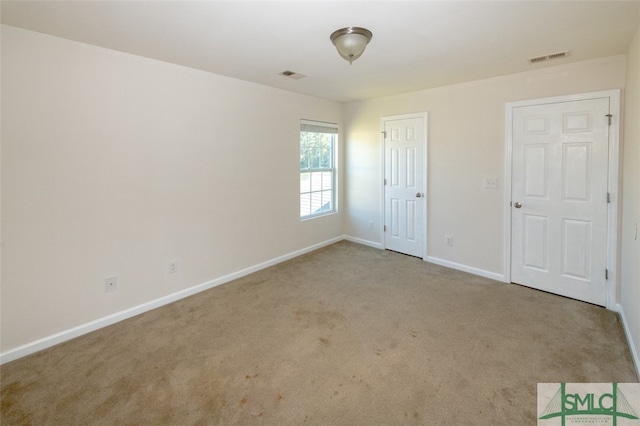 unfurnished bedroom with carpet flooring